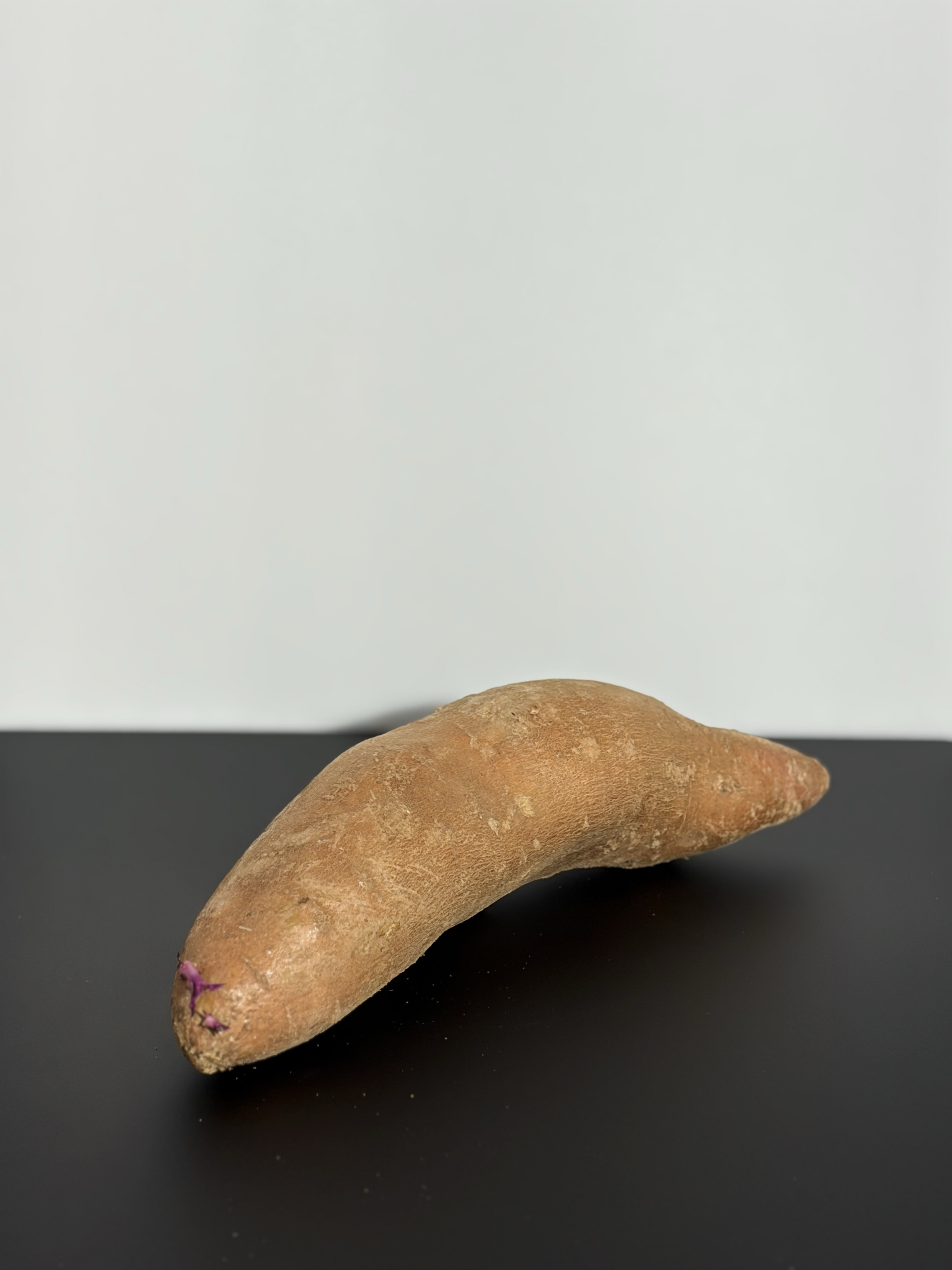 The three-quarter view of a sweet potato