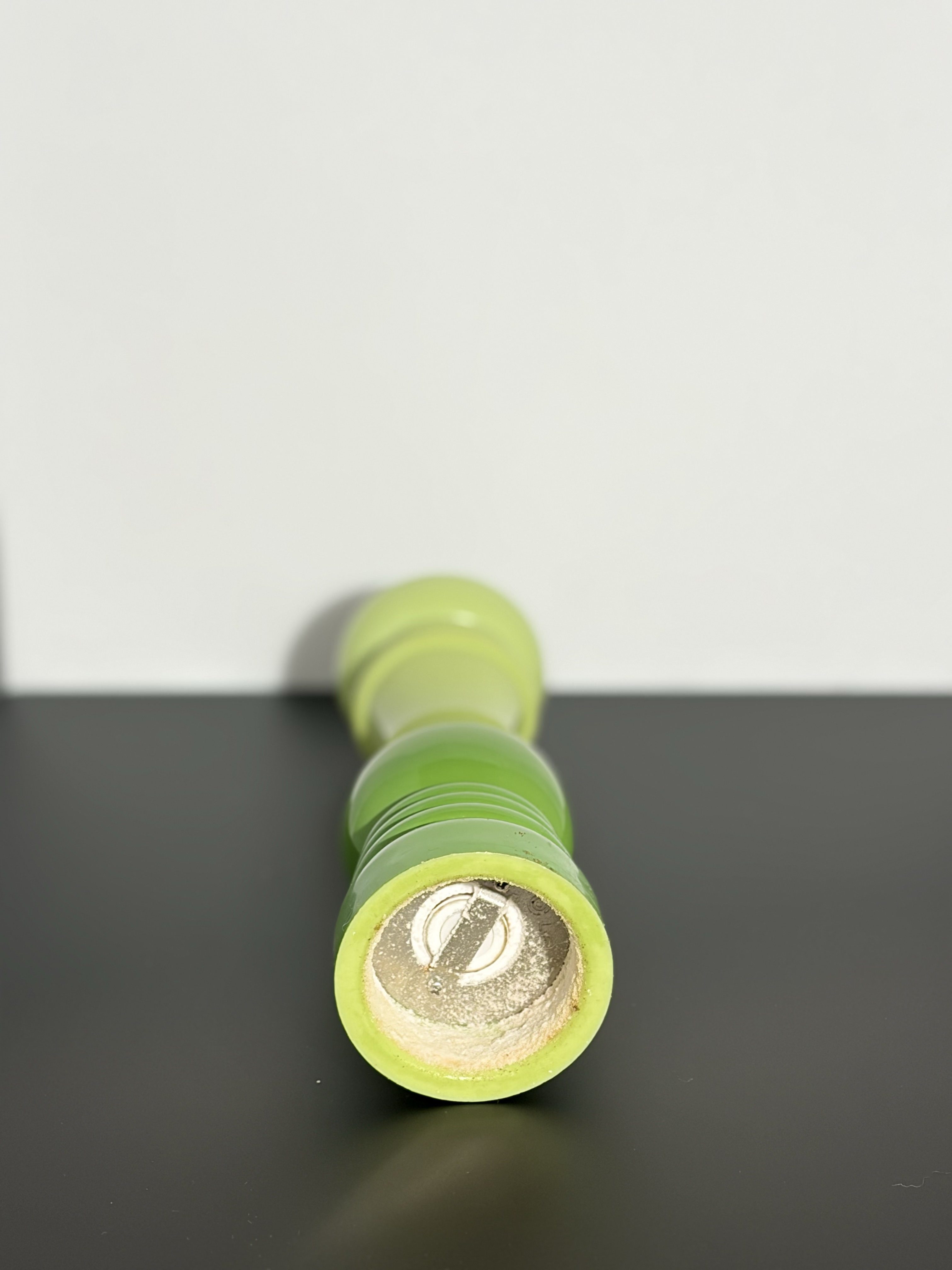The bottom of a salt grinder