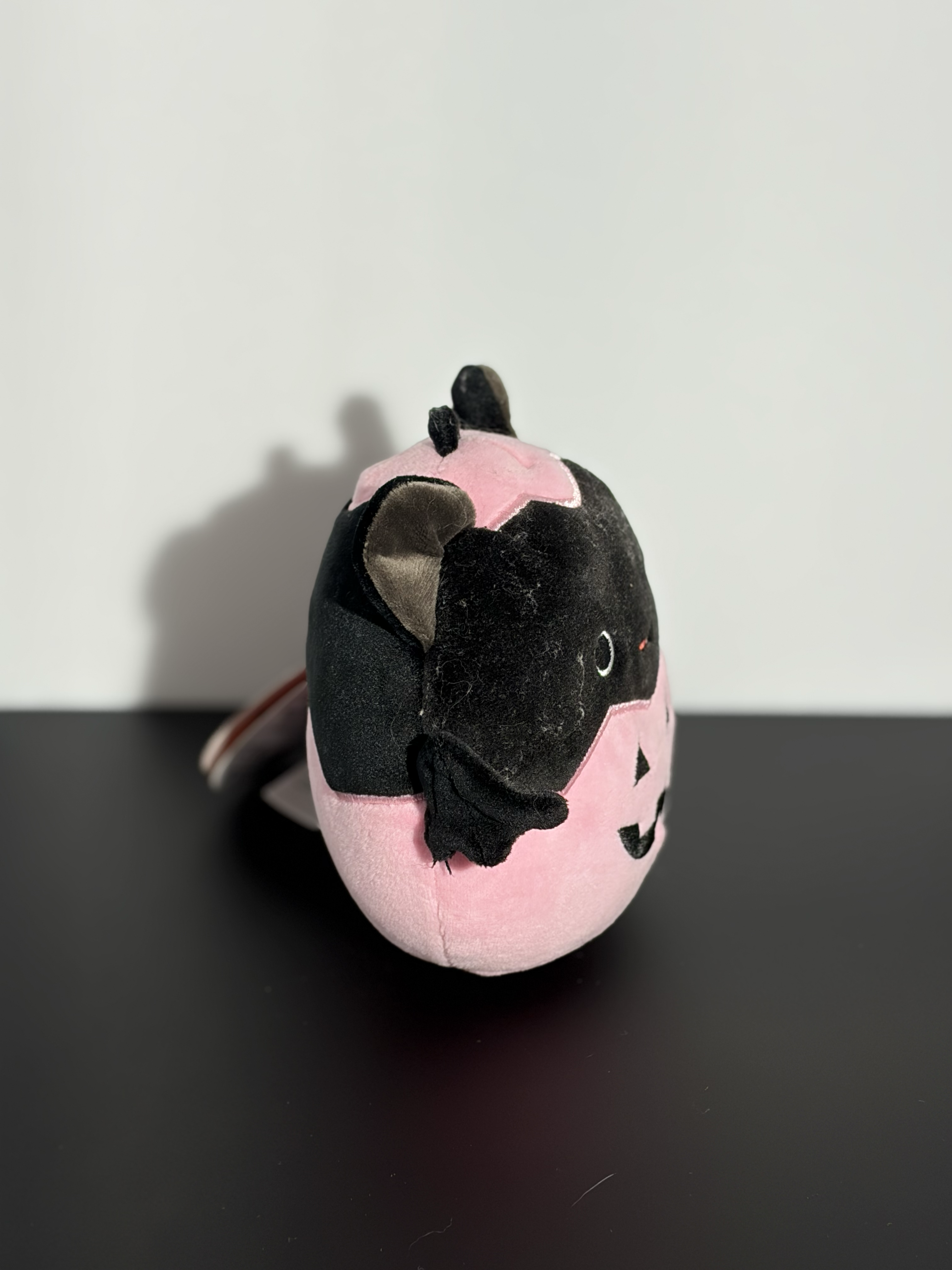 Side of a cat plushy. 