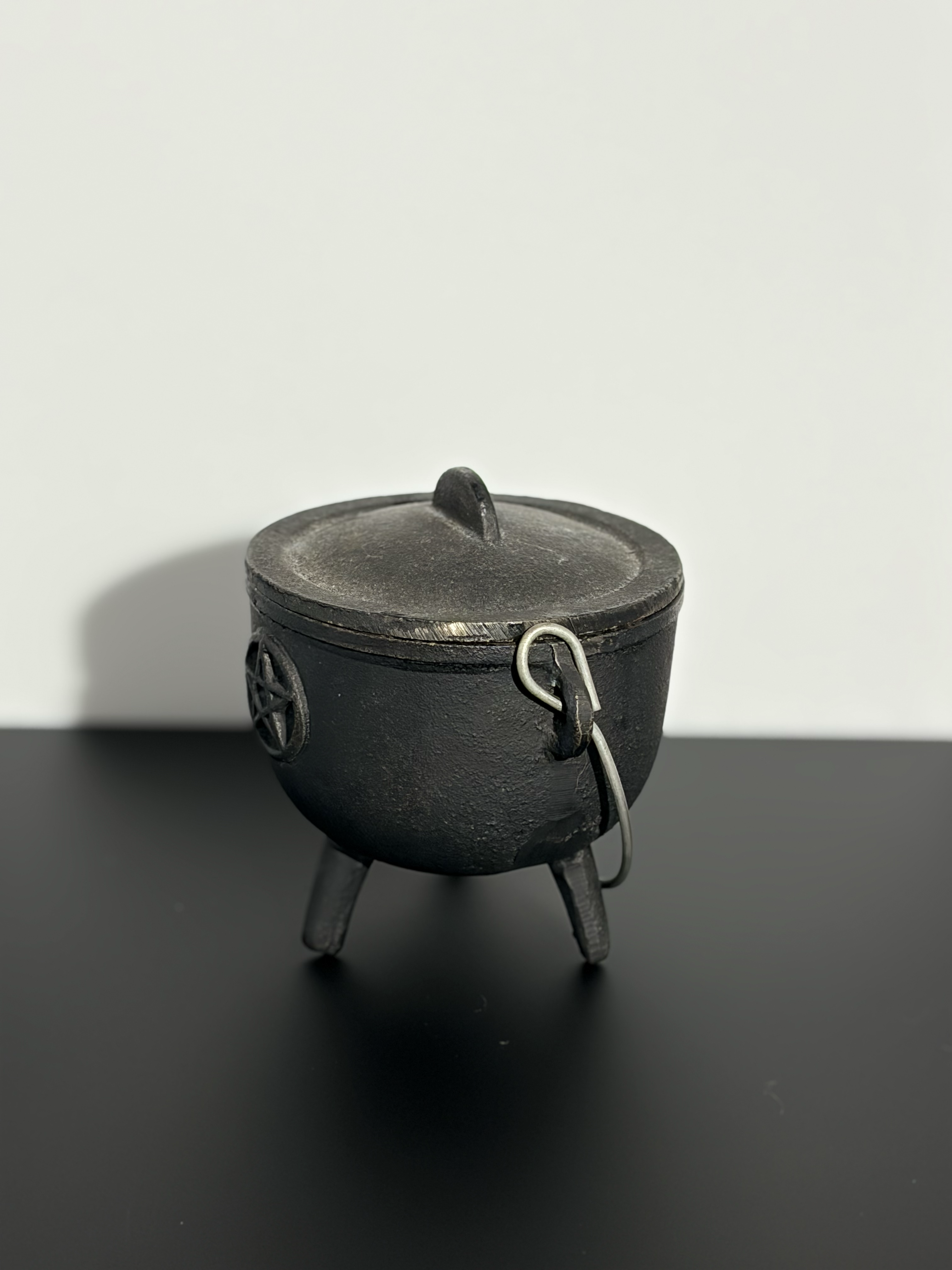 3:4 view of a cauldron.